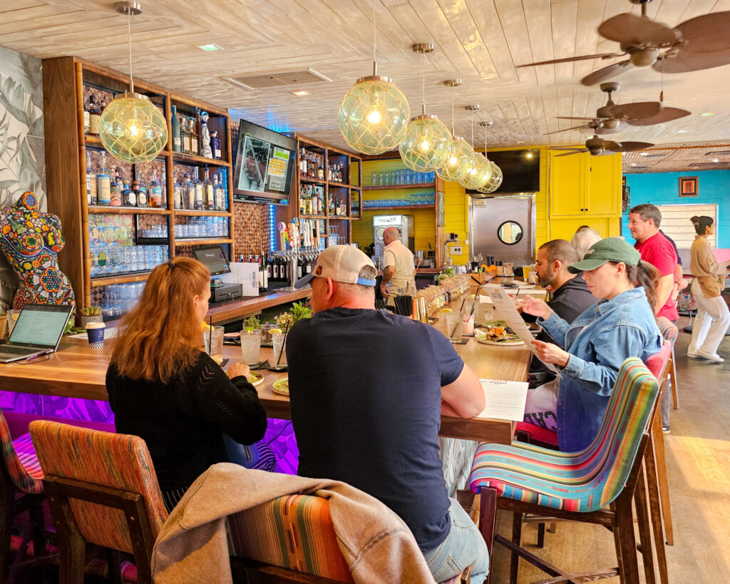 Customers sit at the Nalu Vida Venice Beach bar