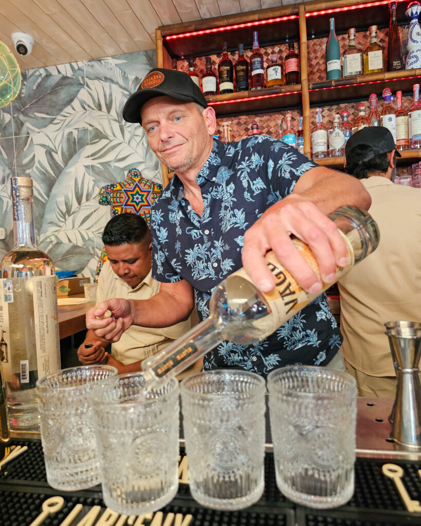 Serving customers at the bar at Nalu Vida Venice Beach