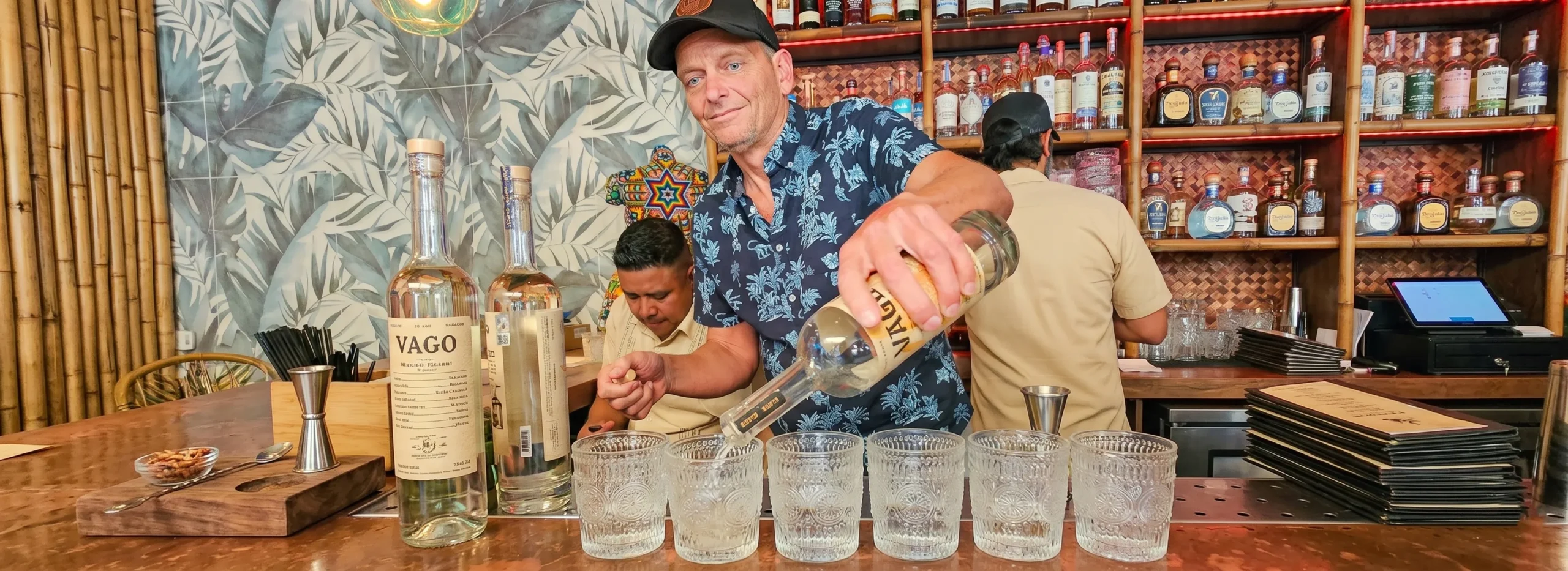 Bartender pouring tequila shots at Nalu Vida